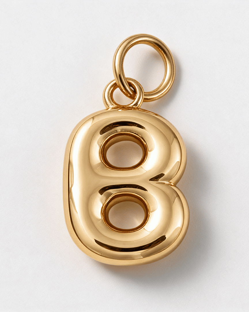 A polished gold charm shaped like the number 8, featuring a smooth, reflective metallic finish and a top loop for attachment, shown on a clean white background. B