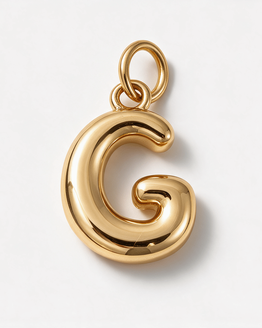 A polished gold initial pendant charm shaped like the letter 'G', shown on a clean white background.
