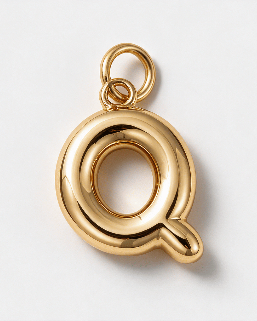 A polished gold letter 'Q' pendant charm with a hanging loop, shown on a clean white background.
