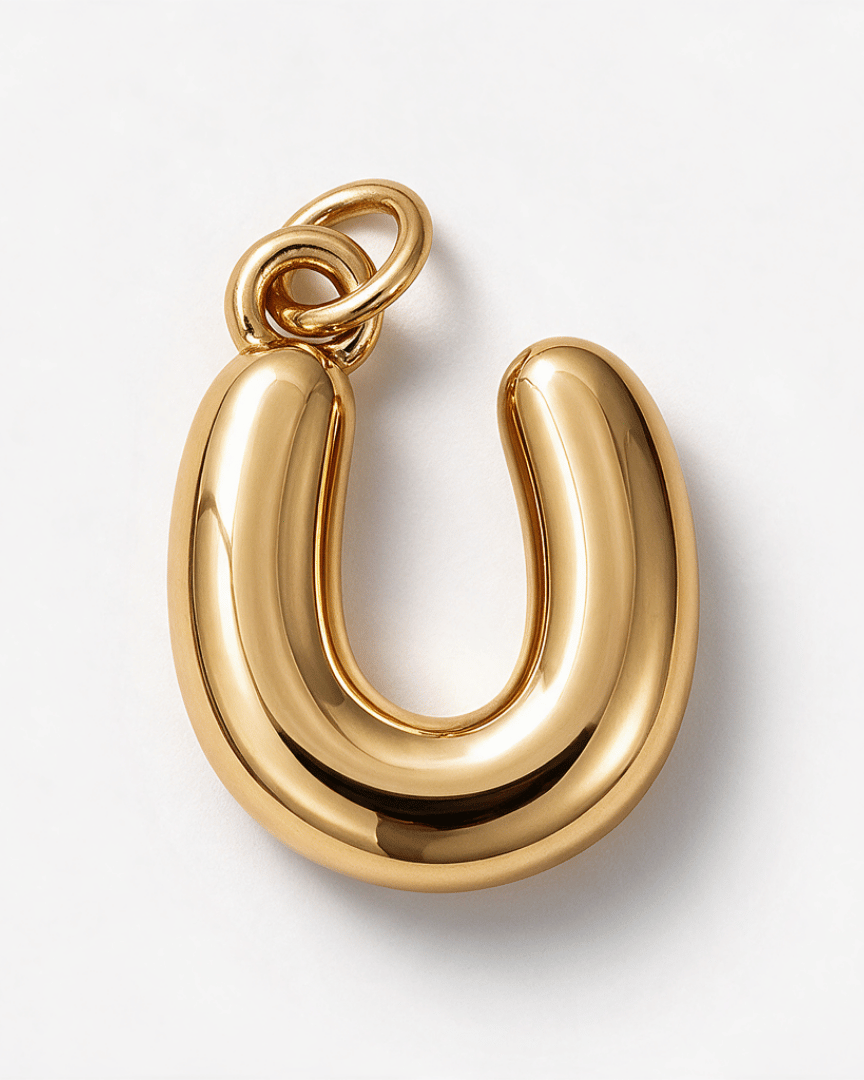A polished gold U-shaped pendant with a smooth, rounded design and a small integrated loop at the top, shown on a clean white background.