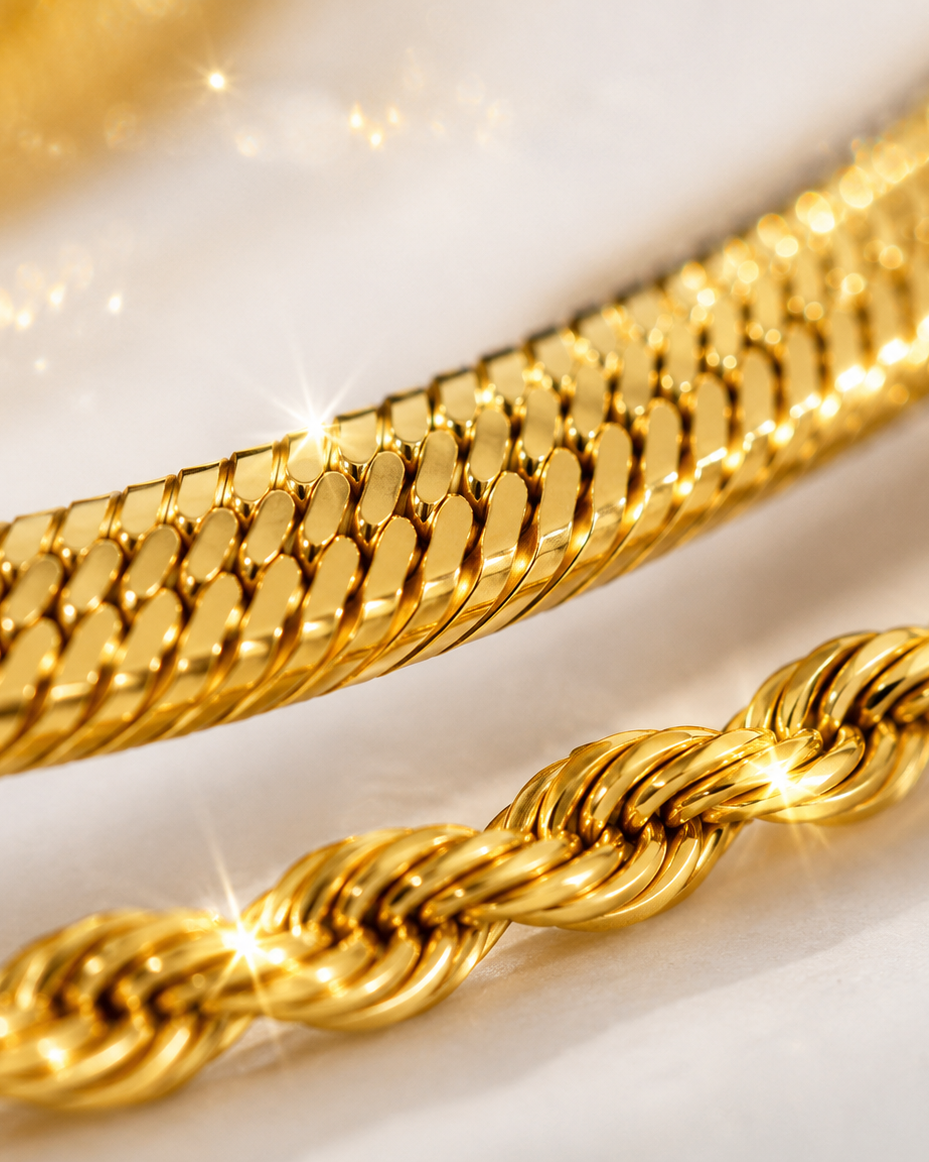 Two gold chains on a white background