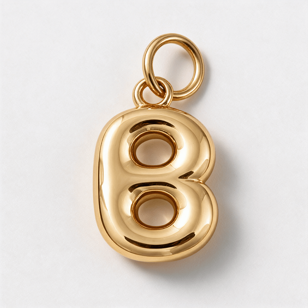 A polished gold charm shaped like the number 8, featuring a smooth, reflective metallic finish and a top loop for attachment, shown on a clean white background. B