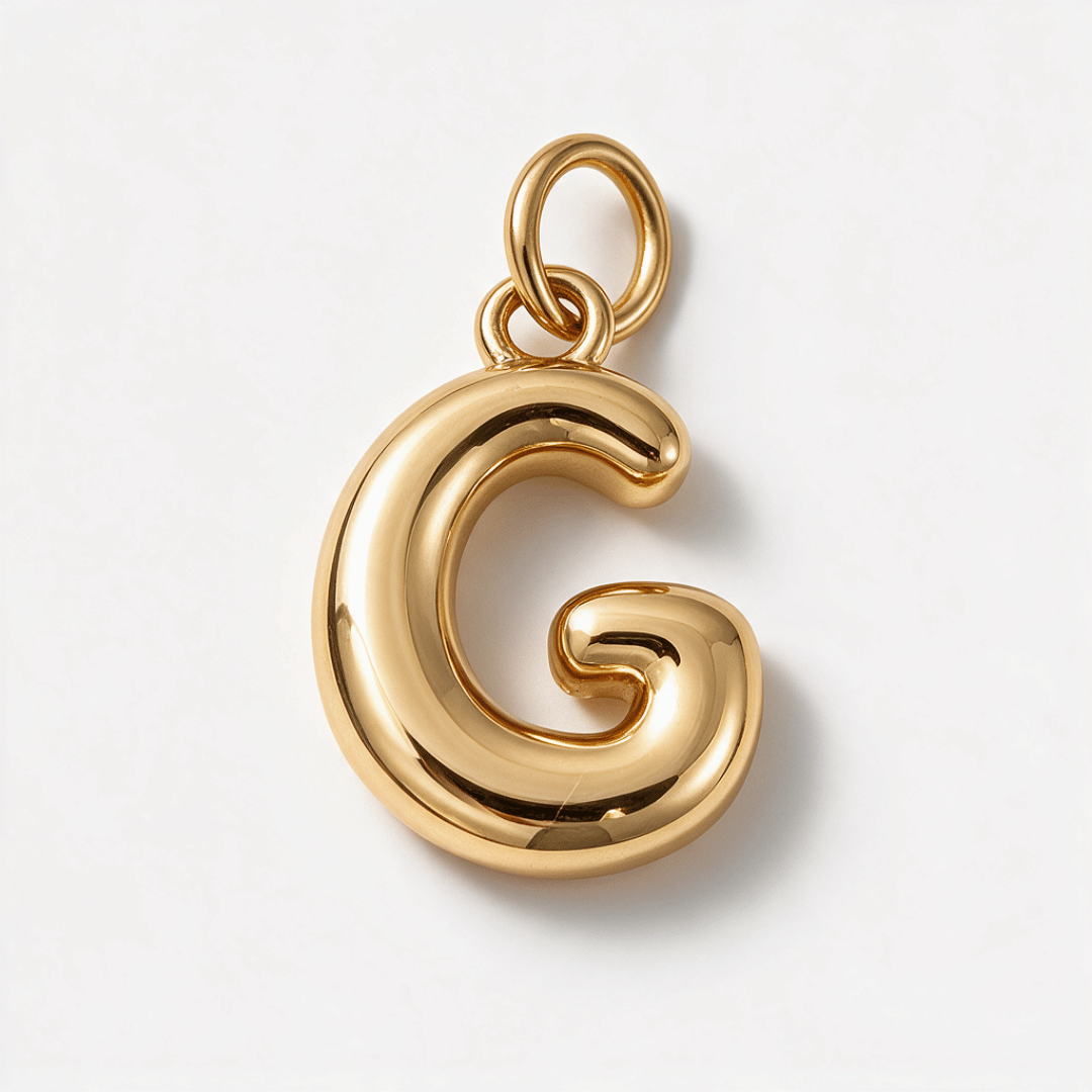 A polished gold initial pendant charm shaped like the letter 'G', shown on a clean white background.