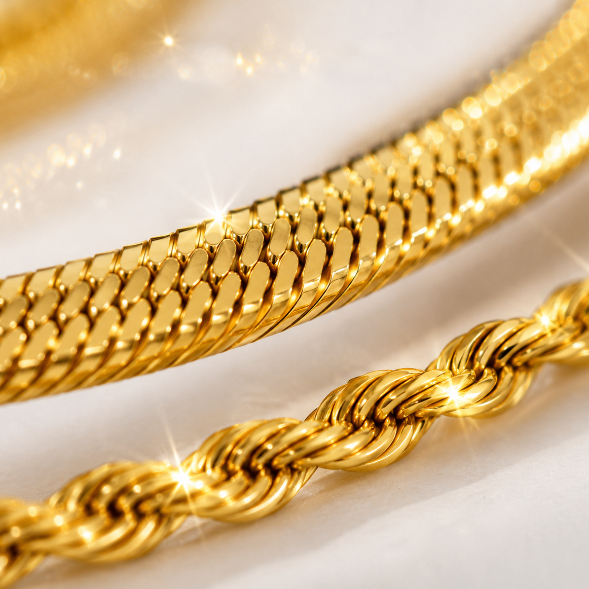 Two gold chains on a white background
